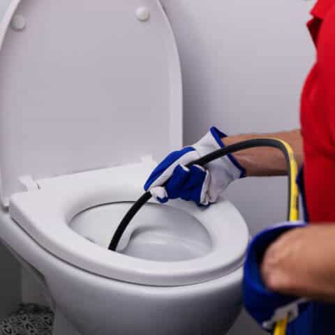 Blocked Toilet being cleared in Warrington